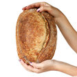 Pan básico en hogaza artesanal La Popular elaborado con masa madre, harina de fuerza y harina integral orgánica, a domicilio en Santiago